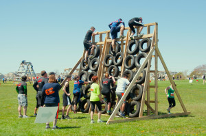 Tire Wall - Boldrdash loves innovation with tires!! On this obstacle you will scale the tires up 12 feet and climb down the slatted wall on the other side.